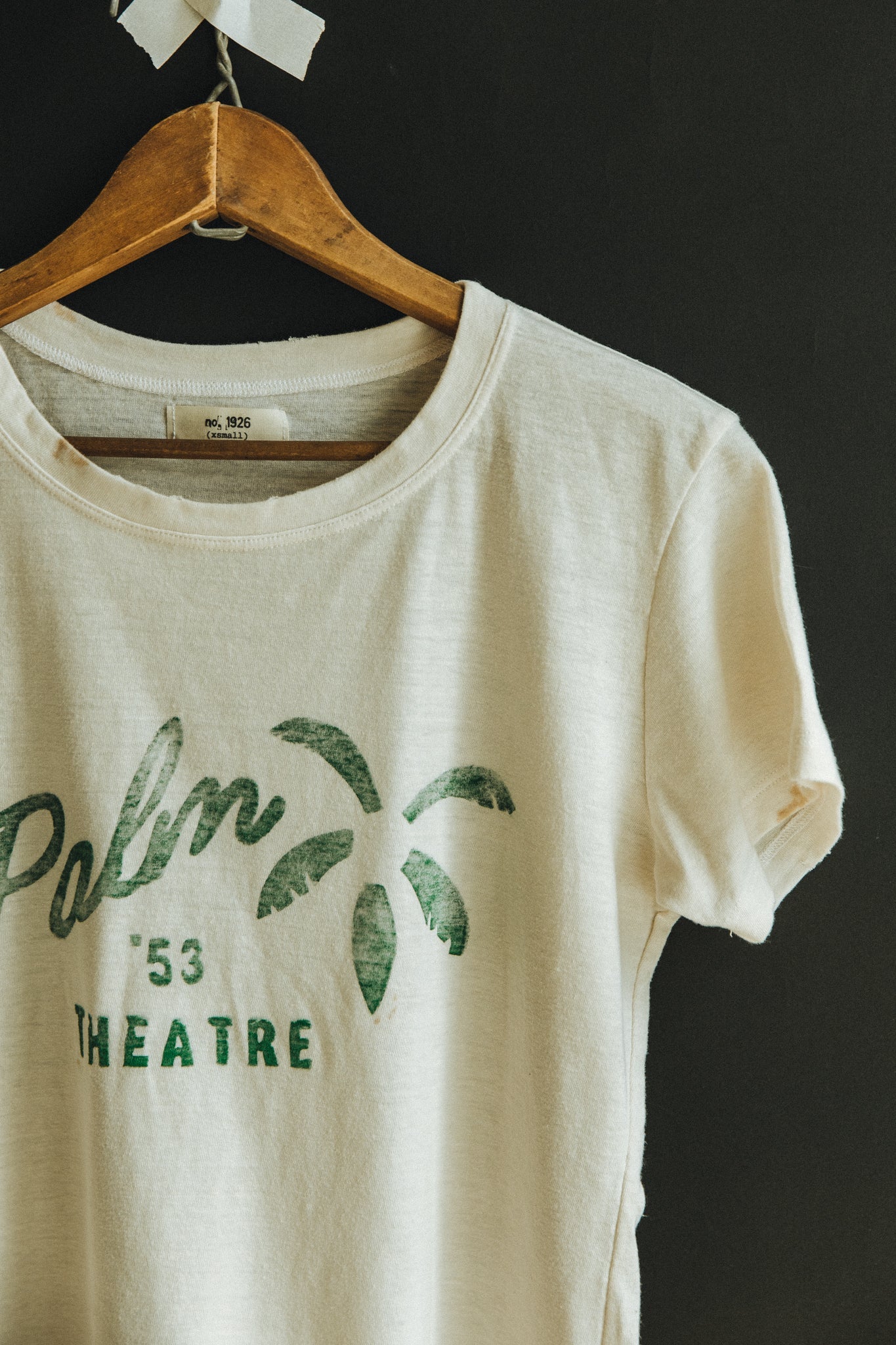 
                  
                    the "palm theatre" tee Tee Number 1926   
                  
                
